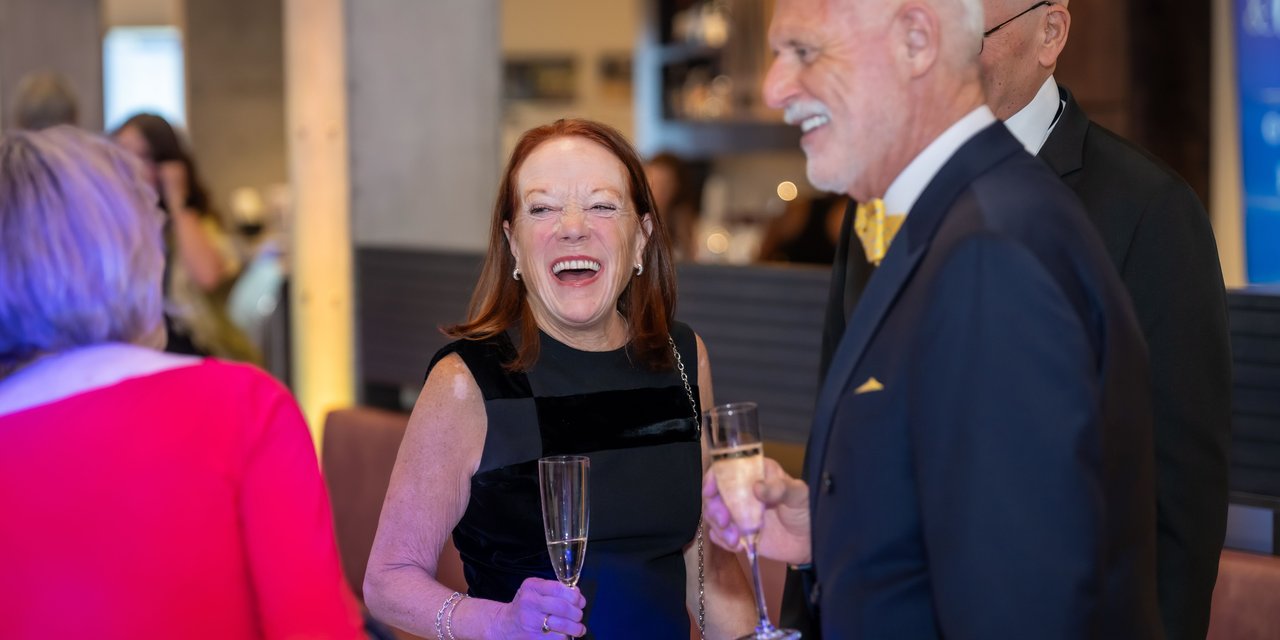 Patrons at Gala With Champagne